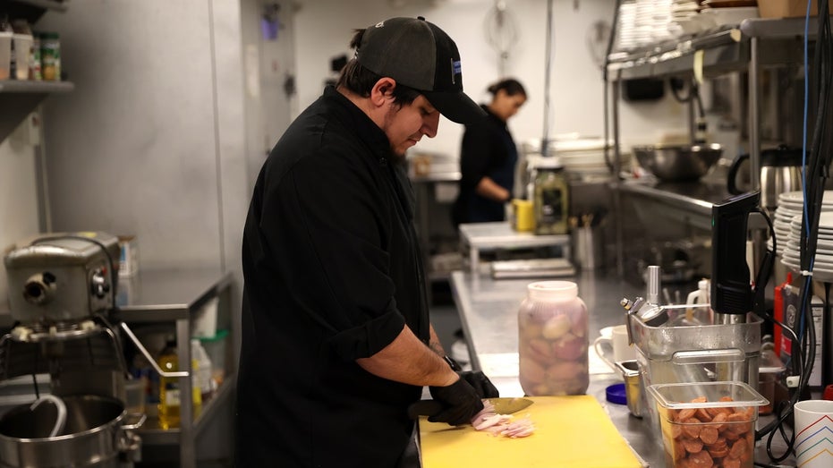 kitchen worker preparing food