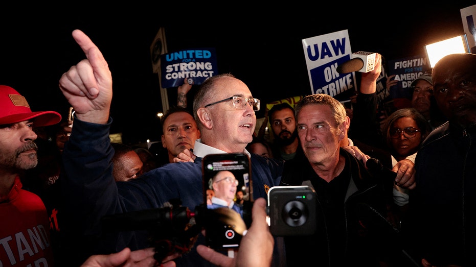 UAW president Shawn Fain speaks to reporters