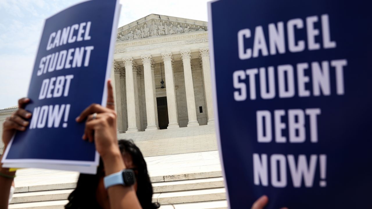 Student debt relief activists participate in a rally at the US Supreme Court on June 30, 2023 in Washington, DC. In a 6-3 decision, the Court struck down the Biden administration's student debt forgiveness program.