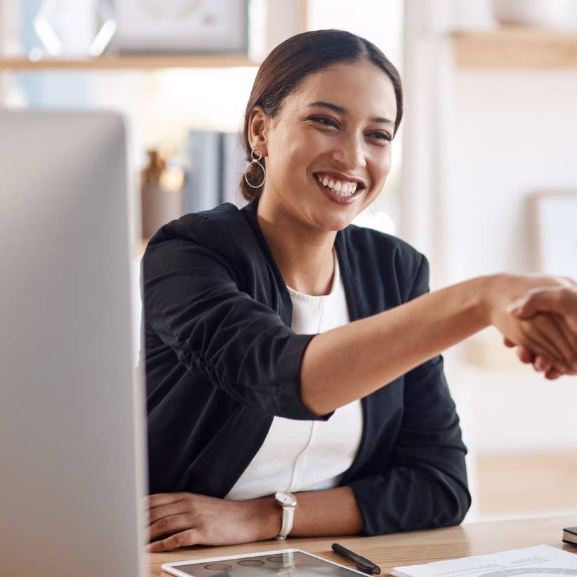 Cropped shot of a young businesswoman shaking hands with a colleague